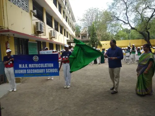 teacher-leading-student-rally